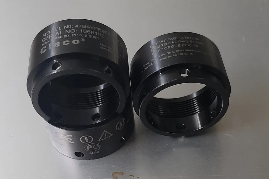 Laser-engraved specifications and symbols on black industrial components