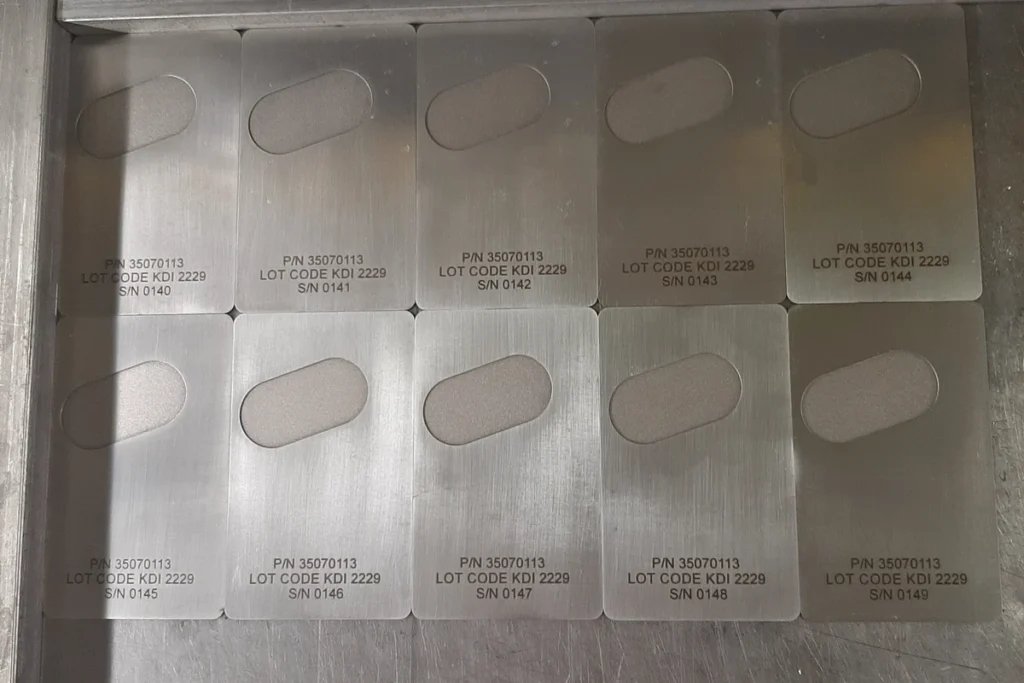 Sequentially laser-engraved serial numbers on a batch of industrial metal parts